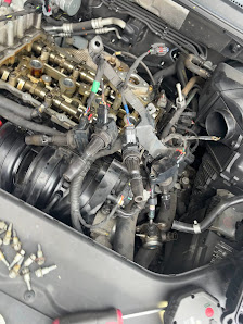 Completed engine-bay repair at Coke's Auto